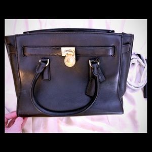 COPY - Michael Kor’s black leather handbag